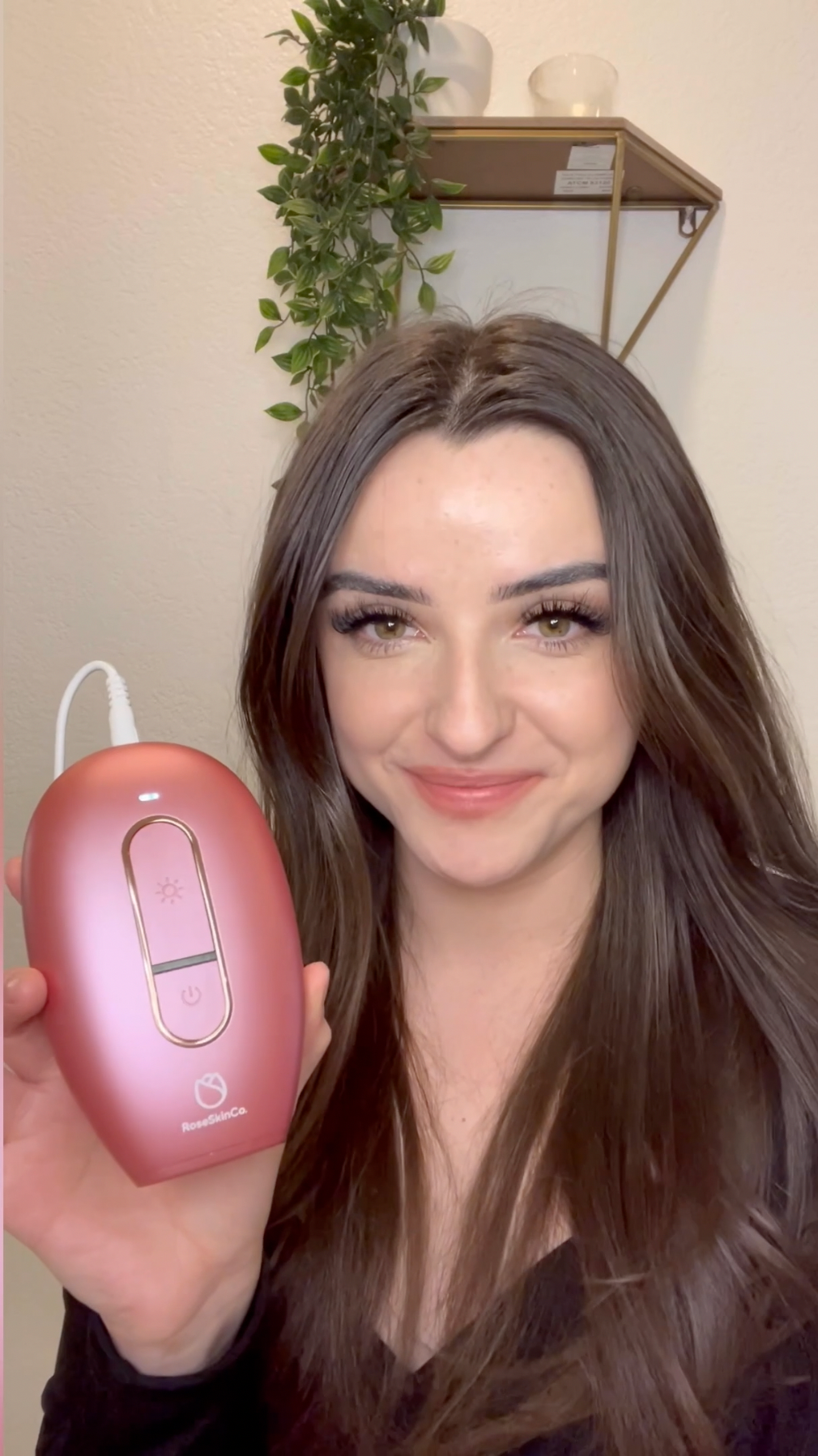 Woman holding Lumi Permanent Hair Removal Device